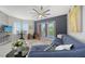 Bright living room with large windows, a balcony, and elegant decor at 1921 Monte Carlo Dr # 302, Sarasota, FL 34231
