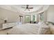 Bright and airy main bedroom with large windows, wood flooring, and a comfortable seating area at 1921 Monte Carlo Dr # 302, Sarasota, FL 34231