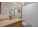 Bathroom features a single sink vanity and shower with curtain at 2048 Larson St, Englewood, FL 34223