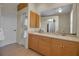 Bathroom with double sink vanity and tile flooring at 2048 Larson St, Englewood, FL 34223