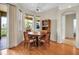 Eat-in kitchen features wood floors, a round table, and an outdoor view at 2048 Larson St, Englewood, FL 34223