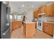 Bright kitchen features stainless appliances, an island, and tile flooring at 2048 Larson St, Englewood, FL 34223