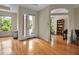 Well-lit living room with hardwood floors and a view of the outside, accessible via a glass door at 2048 Larson St, Englewood, FL 34223