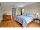 Comfortable main bedroom with hardwood floors and blue accents at 2048 Larson St, Englewood, FL 34223