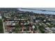 Aerial view showcases the home's location in a residential community near the water at 205 Sugarloaf Dr, Nokomis, FL 34275