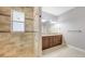 Chic bathroom featuring a tiled shower with a glass door, a granite vanity, and modern fixtures, providing a stylish space at 205 Sugarloaf Dr, Nokomis, FL 34275