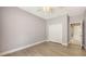 Cozy bedroom with wood floors, a ceiling fan, and a spacious closet, offering a comfortable and inviting retreat at 205 Sugarloaf Dr, Nokomis, FL 34275