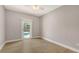 Bright bedroom with wood floors and a sliding glass door that leads to a beautiful pool view, bringing the outdoors in at 205 Sugarloaf Dr, Nokomis, FL 34275