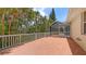 Expansive deck offering views of the pool and lush tropical greenery, perfect for relaxation at 205 Sugarloaf Dr, Nokomis, FL 34275