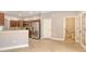 Modern kitchen featuring stainless steel appliances, wooden cabinetry, and a convenient breakfast bar for casual dining at 205 Sugarloaf Dr, Nokomis, FL 34275