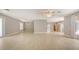 Open-concept living space featuring tile flooring and plenty of natural light at 205 Sugarloaf Dr, Nokomis, FL 34275