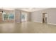 Bright living room with tile floors, bay window and French doors to the pool at 205 Sugarloaf Dr, Nokomis, FL 34275