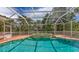 Gorgeous pool and spa with screen enclosure offering ultimate outdoor leisure and privacy at 205 Sugarloaf Dr, Nokomis, FL 34275