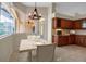 Sunny dining area with cherry cabinets and view of the lanai at 2148 Date Palm Way, Venice, FL 34292