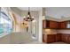 Sunny dining area with cherry cabinets and a view of the lanai at 2148 Date Palm Way, Venice, FL 34292