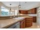 Kitchen featuring custom cabinets, undermount sink and granite countertops at 2148 Date Palm Way, Venice, FL 34292