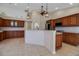 Large kitchen with stainless steel appliances and cherry cabinets at 2148 Date Palm Way, Venice, FL 34292