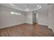 Large bedroom with wood floors, a tray ceiling, and ample space at 2148 Date Palm Way, Venice, FL 34292