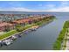 Expansive aerial view of a waterfront community with residential buildings and docks at 2741 Via Cipriani # 935A, Clearwater, FL 33764