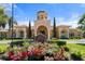 Stately clubhouse with terracotta roof and manicured landscaping provides a warm welcome at 2741 Via Cipriani # 935A, Clearwater, FL 33764