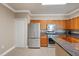 Modern kitchen featuring stainless steel appliances, ample cabinet space, and breakfast bar at 2741 Via Cipriani # 935A, Clearwater, FL 33764