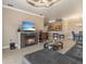 Open living room with fireplace, bar, and kitchen area perfect for entertaining and everyday living at 2741 Via Cipriani # 935A, Clearwater, FL 33764