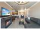 Spacious open-plan living room with fireplace, bar, kitchen, and dining area for a modern lifestyle at 2741 Via Cipriani # 935A, Clearwater, FL 33764