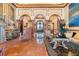 Elegant living room showcasing arched doorways, marble flooring, and stylish furnishings at 2741 Via Cipriani # 935A, Clearwater, FL 33764