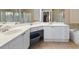 Main bathroom features dual sinks, white cabinets, and a vanity at 2741 Via Cipriani # 935A, Clearwater, FL 33764