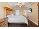 Main bedroom featuring wood floors, a ceiling fan, and a tv at 2741 Via Cipriani # 935A, Clearwater, FL 33764