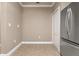 Walk-in pantry featuring tile floors and a stainless steel refrigerator at 2741 Via Cipriani # 935A, Clearwater, FL 33764