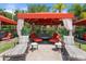 Relaxing cabana area with comfortable seating and lounge chairs overlooks the community pool at 2741 Via Cipriani # 935A, Clearwater, FL 33764