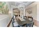 Bright dining room showcasing an oversized chandelier and decorative accents at 303 Cockle Shell Loop, Apollo Beach, FL 33572