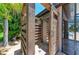 Rustic, tropical outdoor shower with slatted wood walls and stone tile, offering a refreshing space at 303 Cockle Shell Loop, Apollo Beach, FL 33572