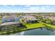 An impressive aerial view showcasing the property's lush landscaping and scenic water views, adding to its charm at 3344 Anchor Bay Trl, Bradenton, FL 34211