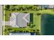 An impressive aerial view showcasing the property's lush landscaping and scenic water views, adding to its charm at 3344 Anchor Bay Trl, Bradenton, FL 34211