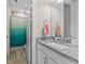 Stylish bathroom featuring a granite countertop vanity with a sink, neutral walls and flooring and shower at 3344 Anchor Bay Trl, Bradenton, FL 34211