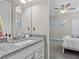 Stylish bathroom featuring a granite countertop vanity with a sink, neutral walls and flooring at 3344 Anchor Bay Trl, Bradenton, FL 34211