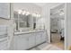 Bathroom with double vanity, granite countertop, and access to the tiled shower and bedroom at 3344 Anchor Bay Trl, Bradenton, FL 34211