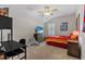 Cozy bedroom featuring carpet floors, a ceiling fan, and a comfortable bed, perfect for relaxing and unwinding at 3344 Anchor Bay Trl, Bradenton, FL 34211
