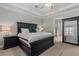 Spacious bedroom with tray ceilings, dark wood furnishings, and plush bedding offers a serene retreat at 3344 Anchor Bay Trl, Bradenton, FL 34211