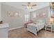 Charming bedroom with decoratively framed pictures, with natural light from the shuttered windows at 3344 Anchor Bay Trl, Bradenton, FL 34211