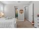 Cozy carpeted bedroom features neutral walls, and flooring, with natural light from the window at 3344 Anchor Bay Trl, Bradenton, FL 34211