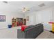 Bright bonus room with neutral walls and carpet, ceiling fan, storage and ample space for flexible living at 3344 Anchor Bay Trl, Bradenton, FL 34211