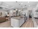 Open concept home featuring modern kitchen with granite counters, stainless appliances, and breakfast bar at 3344 Anchor Bay Trl, Bradenton, FL 34211