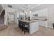 Open kitchen featuring granite island, stainless appliances, seamless flow to additional living spaces at 3344 Anchor Bay Trl, Bradenton, FL 34211