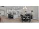 Open concept kitchen with an island, lots of cabinets, stainless steel appliances and bright light fixtures at 3344 Anchor Bay Trl, Bradenton, FL 34211