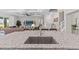 Spacious kitchen island with stainless steel sink, granite countertops, and seating area, perfect for entertaining at 3344 Anchor Bay Trl, Bradenton, FL 34211