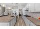 Bright kitchen featuring granite countertops, stainless appliances, modern lighting and adjacent dining area at 3344 Anchor Bay Trl, Bradenton, FL 34211