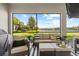 Relaxing outdoor patio with comfortable seating and stunning lake views, ideal for enjoying nature at 3344 Anchor Bay Trl, Bradenton, FL 34211